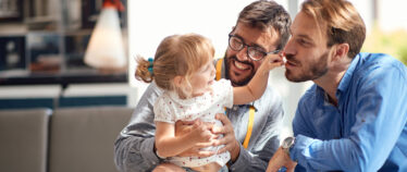 parents sharing a happy moment with their child